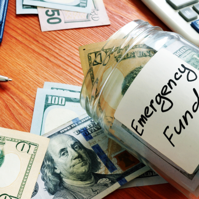 jar with money and emergency fund label