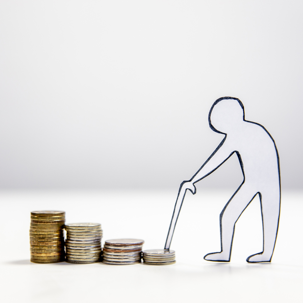 person holding a cane going up a stack of coins